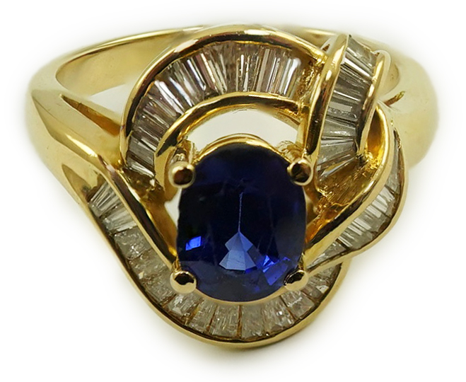 A modern 18k gold, sapphire and diamond cluster set dress ring